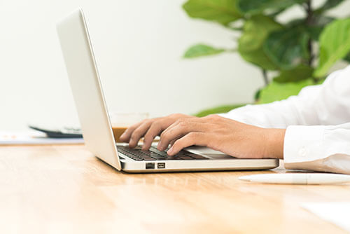 photo of man with laptop